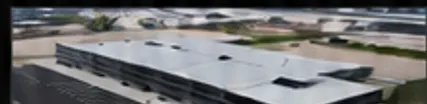 Aerial view of a completed commercial building with metal decking roof
