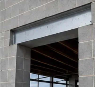 Galvanized steel lintel installed above a doorway opening in a concrete block wall