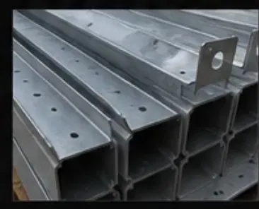 Close-up of stacked galvanized lintels with punched holes